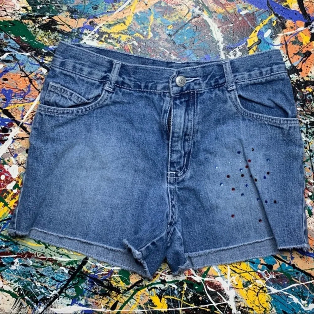 THE CHILDREN’S PLACE blue denim “cut-off” shorts.